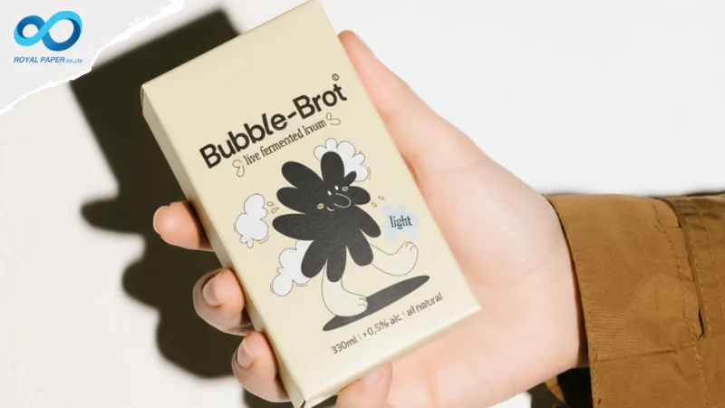 มือจับกล่อง Bubble-Brot สีครีม โชว์ขนาดกล่องและรายละเอียดกราฟิกด้านหน้า